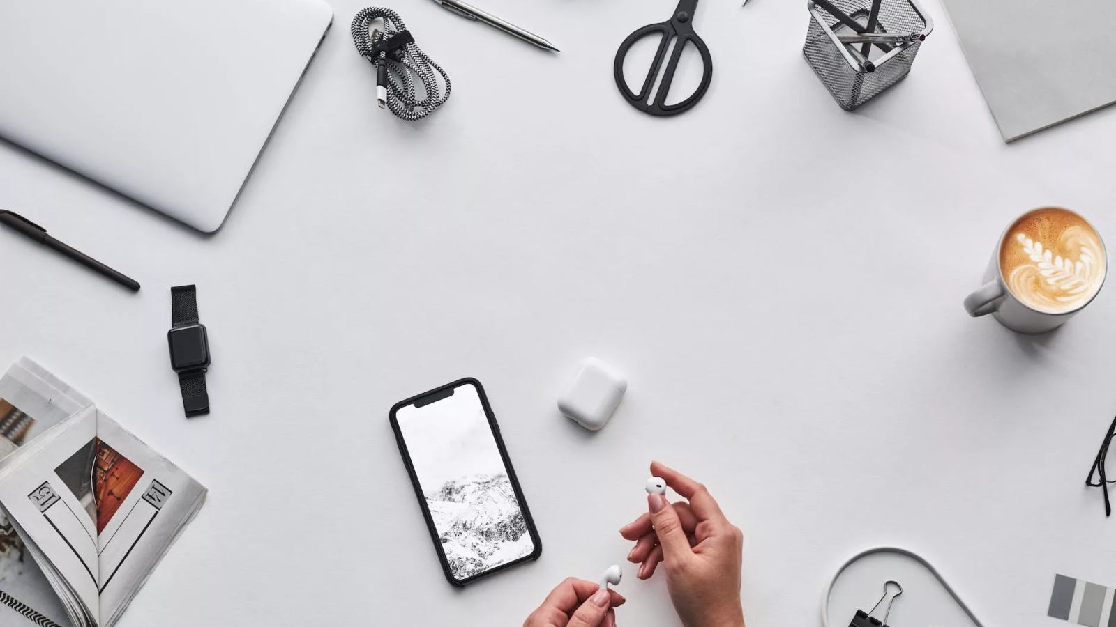 top view photo of person holding earphones